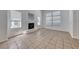 Spacious living area featuring tiled floors, modern fireplace, and large sunlit windows at 2766 Red Vista Ct, Henderson, NV 89074
