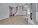 Spacious living room boasts an open floor plan, stairs, and a cozy fireplace at 2766 Red Vista Ct, Henderson, NV 89074