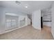 Open loft with tile floors and a view of the stairs and kitchen at 2766 Red Vista Ct, Henderson, NV 89074