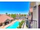 Community pool with lounge chairs, lush landscaping, and mature trees, perfect for relaxation at 2766 Red Vista Ct, Henderson, NV 89074