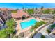 Aerial view of the community pool and clubhouse surrounded by lush landscaping, perfect for relaxation at 2766 Red Vista Ct, Henderson, NV 89074