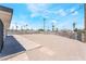 Large backyard featuring a mix of concrete and gravel surrounded by a grey concrete block wall at 2854 La Canada St, Las Vegas, NV 89169