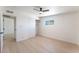 Bedroom with a ceiling fan, light-colored wood floor, closet with sliding doors and window for natural light at 2854 La Canada St, Las Vegas, NV 89169