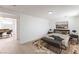 Staged bedroom with hardwood floors, neutral decor, and ample natural light at 2854 La Canada St, Las Vegas, NV 89169