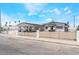 Charming single-story home featuring a carport, gated front yard, and desert landscaping at 2854 La Canada St, Las Vegas, NV 89169