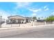 Charming single-story home featuring a carport, gated front yard, and desert landscaping at 2854 La Canada St, Las Vegas, NV 89169