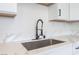 Close-up of kitchen sink with modern faucet and white quartz countertops at 2854 La Canada St, Las Vegas, NV 89169