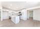 Bright kitchen featuring white cabinets, stainless appliances, and an island with stone countertop at 2854 La Canada St, Las Vegas, NV 89169
