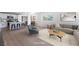 Staged living room showcasing modern furniture and an open concept design with the kitchen at 2854 La Canada St, Las Vegas, NV 89169