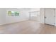 Bright living room featuring hardwood floors, large windows, and a minimalist design at 2854 La Canada St, Las Vegas, NV 89169