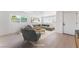 Staged living room showcasing modern furniture and hardwood floors with lots of natural light at 2854 La Canada St, Las Vegas, NV 89169