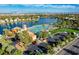 Scenic aerial view of community with lake, beach, and parking at 3125 N Buffalo Dr # 1133, Las Vegas, NV 89128