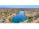 Aerial view of the community showcasing the beautiful lake and surrounding neighborhood at 3125 N Buffalo Dr # 1133, Las Vegas, NV 89128