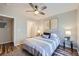 Cozy bedroom with ceiling fan, wood floors, and walk-in closet at 3125 N Buffalo Dr # 1133, Las Vegas, NV 89128