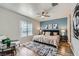 Stylish bedroom features a ceiling fan, accent wall, and decorative artwork at 3125 N Buffalo Dr # 1133, Las Vegas, NV 89128