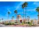 Stunning clubhouse with desert landscaping and palm trees set against a brilliant blue sky at 3125 N Buffalo Dr # 1133, Las Vegas, NV 89128