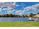 Scenic lake view with boats docked and lush green lawns at 3125 N Buffalo Dr # 1133, Las Vegas, NV 89128