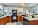 Well-equipped kitchen features granite countertops, stainless steel appliances, and ample cabinet space at 3125 N Buffalo Dr # 1133, Las Vegas, NV 89128