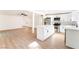 Open-concept kitchen with white cabinets, a center island, and stainless steel appliances, creating a functional space at 3320 Osage Ave, Las Vegas, NV 89101