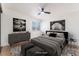 This virtually staged main bedroom features modern decor and a neutral color palette at 3320 Osage Ave, Las Vegas, NV 89101