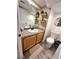 Bathroom features a granite countertop, a decorative mirror, plants and modern sink fixtures at 39 Belle La Blanc Ave, Las Vegas, NV 89123