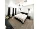 Primary bedroom with neutral color palette, plush carpet, and contemporary furnishings at 39 Belle La Blanc Ave, Las Vegas, NV 89123