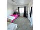 Cozy bedroom with carpeted floors and a window dressed with dark curtains at 39 Belle La Blanc Ave, Las Vegas, NV 89123