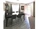 Dining room features a large table and wood laminate flooring at 39 Belle La Blanc Ave, Las Vegas, NV 89123