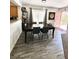 Dining room features a large table and wood laminate flooring at 39 Belle La Blanc Ave, Las Vegas, NV 89123