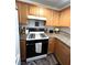 Updated kitchen boasts granite countertops, wood cabinetry, and a modern range at 39 Belle La Blanc Ave, Las Vegas, NV 89123