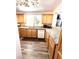 Bright kitchen with granite countertops, wood cabinets and stainless steel appliances offers ample counter space at 39 Belle La Blanc Ave, Las Vegas, NV 89123