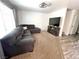 A living room with large windows, carpet, and a comfortable sectional couch at 39 Belle La Blanc Ave, Las Vegas, NV 89123