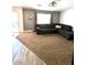 A comfortable living room with large windows and neutral-toned carpet at 39 Belle La Blanc Ave, Las Vegas, NV 89123