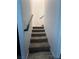 Carpeted staircase provides access to the upper level of the home at 39 Belle La Blanc Ave, Las Vegas, NV 89123