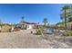 The spacious backyard features a pool, wooden shed, patio, landscaping, and desert rock at 4010 Hemphill St, North Las Vegas, NV 89032