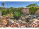 Backyard fishpond with rock landscaping and mature plants at 4010 Hemphill St, North Las Vegas, NV 89032