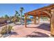 Backyard area featuring a covered patio, desert landscaping and a fenced swimming pool at 4010 Hemphill St, North Las Vegas, NV 89032