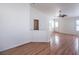 Bright bedroom featuring hardwood floors, a ceiling fan, with a closet and access to bathroom at 4010 Hemphill St, North Las Vegas, NV 89032