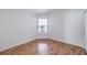Bedroom with laminate floors and a window with blinds allowing for natural light at 4010 Hemphill St, North Las Vegas, NV 89032