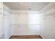 Walk-in closet with ample shelving and laminate flooring, providing plenty of storage space at 4010 Hemphill St, North Las Vegas, NV 89032
