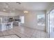 Bright dining room area featuring a pendant light, tile floors, and sliding glass door to the backyard at 4010 Hemphill St, North Las Vegas, NV 89032