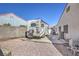 View of the long side driveway with parking for an RV at 4010 Hemphill St, North Las Vegas, NV 89032