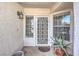 Close-up of the home's front door with decorative security screen and surrounding succulent plants at 4010 Hemphill St, North Las Vegas, NV 89032