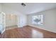 Spacious living room with wood floors and French doors leading to the entryway at 4010 Hemphill St, North Las Vegas, NV 89032