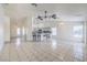Spacious living area with tile flooring, a breakfast bar, and views into the kitchen at 4010 Hemphill St, North Las Vegas, NV 89032
