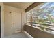 Balcony with concrete floors, stucco walls, a metal railing, and neighborhood views at 5038 S Rainbow Blvd # 206, Las Vegas, NV 89118