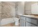 Nicely-appointed bathroom featuring tiled shower, granite counters, and modern fixtures at 5038 S Rainbow Blvd # 206, Las Vegas, NV 89118