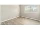 Bedroom with vinyl plank flooring, neutral walls and a sun-filled window at 5038 S Rainbow Blvd # 206, Las Vegas, NV 89118