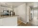 Well-lit kitchen features stone countertops, white cabinets, and stainless steel appliances at 5038 S Rainbow Blvd # 206, Las Vegas, NV 89118