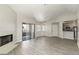 Bright living room with fireplace, wood floors, and sliding door to the outside at 5038 S Rainbow Blvd # 206, Las Vegas, NV 89118